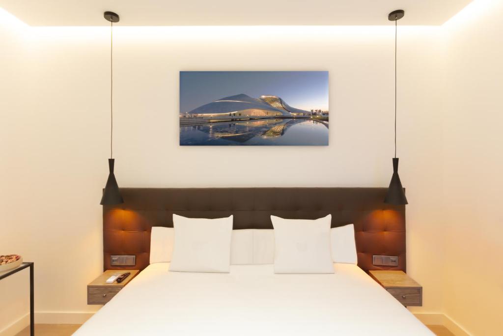 Postel nebo postele na pokoji v ubytování Woohoo Rooms Boutique Gran Vía