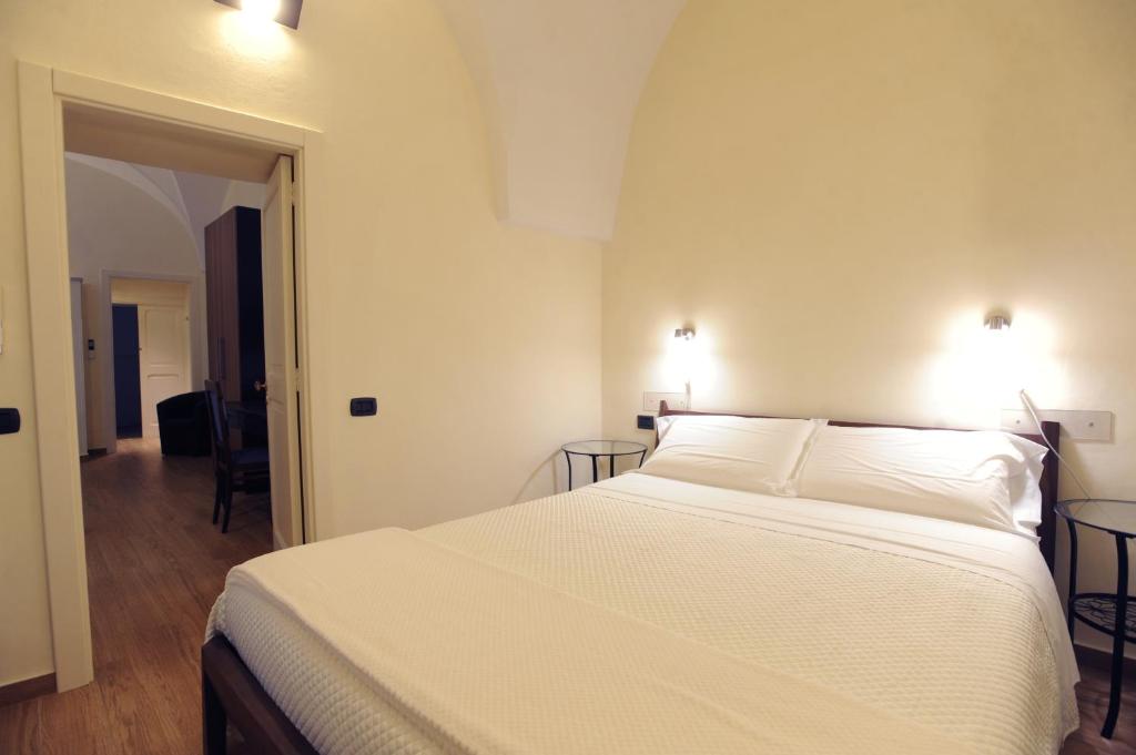 Postel nebo postele na pokoji v ubytování Negramaro Suite B&B
