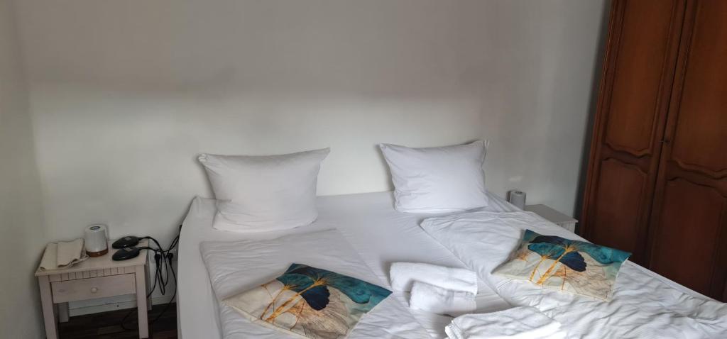 Postel nebo postele na pokoji v ubytování Hotel Bischoff Winnweiler