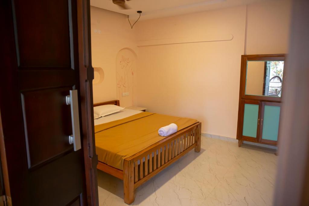 Postel nebo postele na pokoji v ubytování Marari Edens