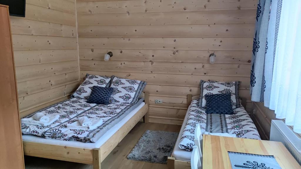 Posteľ alebo postele v izbe v ubytovaní Pokoje u Jędragów