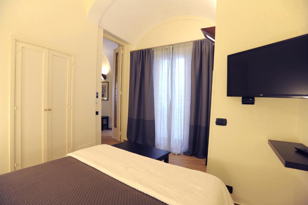TV a/nebo společenská místnost v ubytování Negramaro Suite B&B
