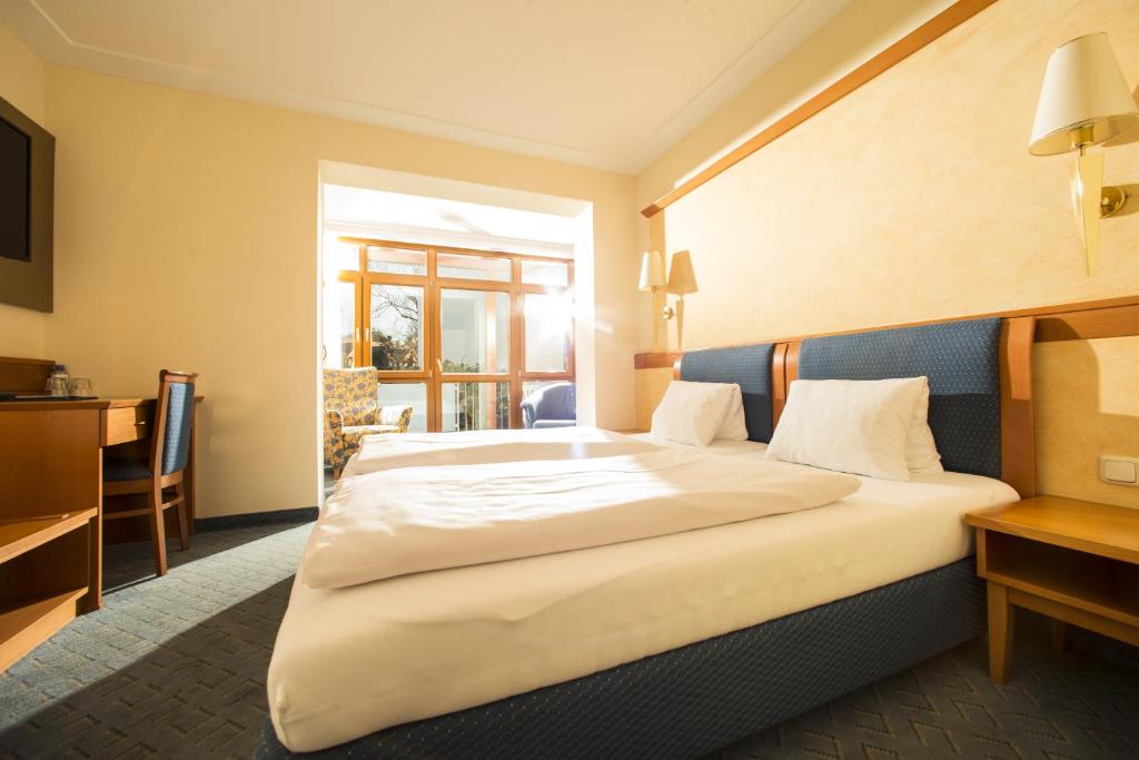 Postel nebo postele na pokoji v ubytování Hotel Locker & Legere