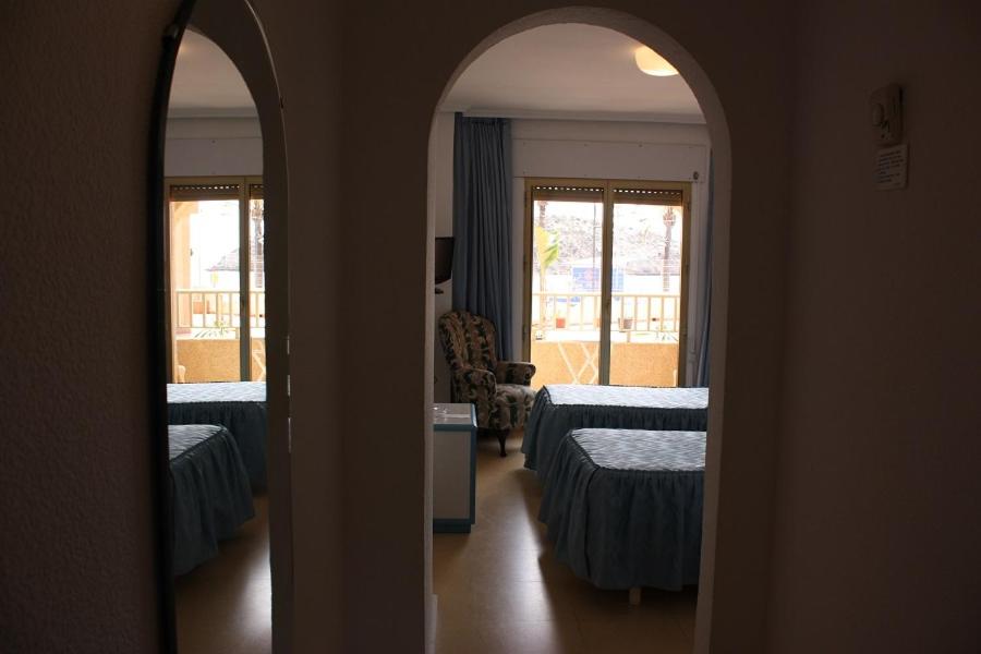 Postel nebo postele na pokoji v ubytování Hotel Playa Grande