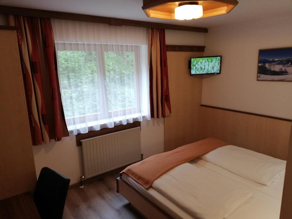 Postel nebo postele na pokoji v ubytování Hotel-Garni Seestrand