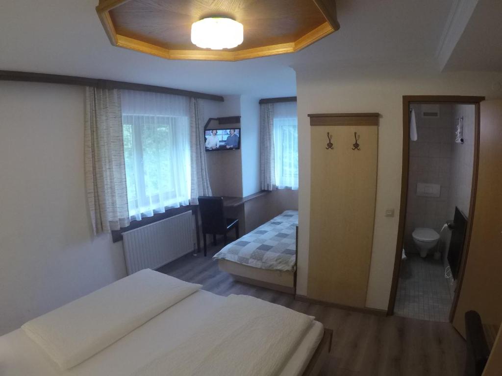 Postel nebo postele na pokoji v ubytování Hotel-Garni Seestrand