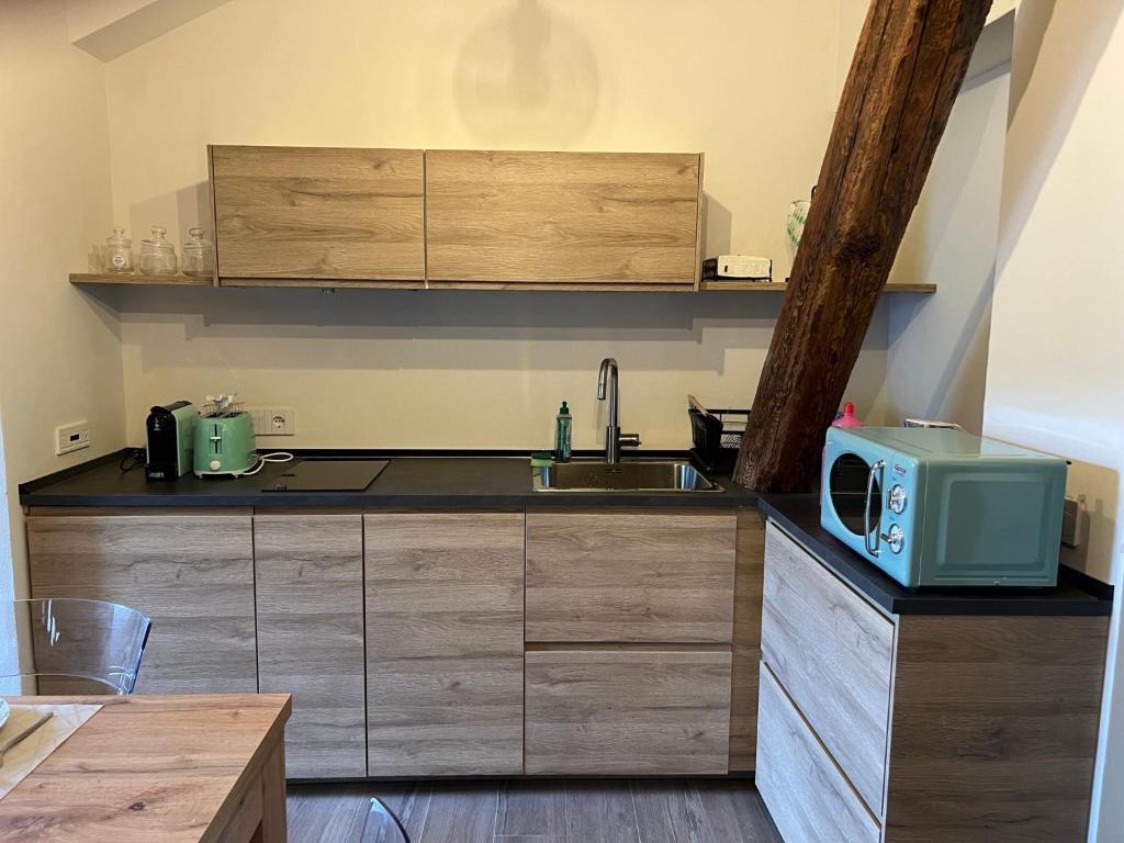 Kuchyňa alebo kuchynka v ubytovaní BelAbrì - central charme&comfort -mansarde e appartamento
