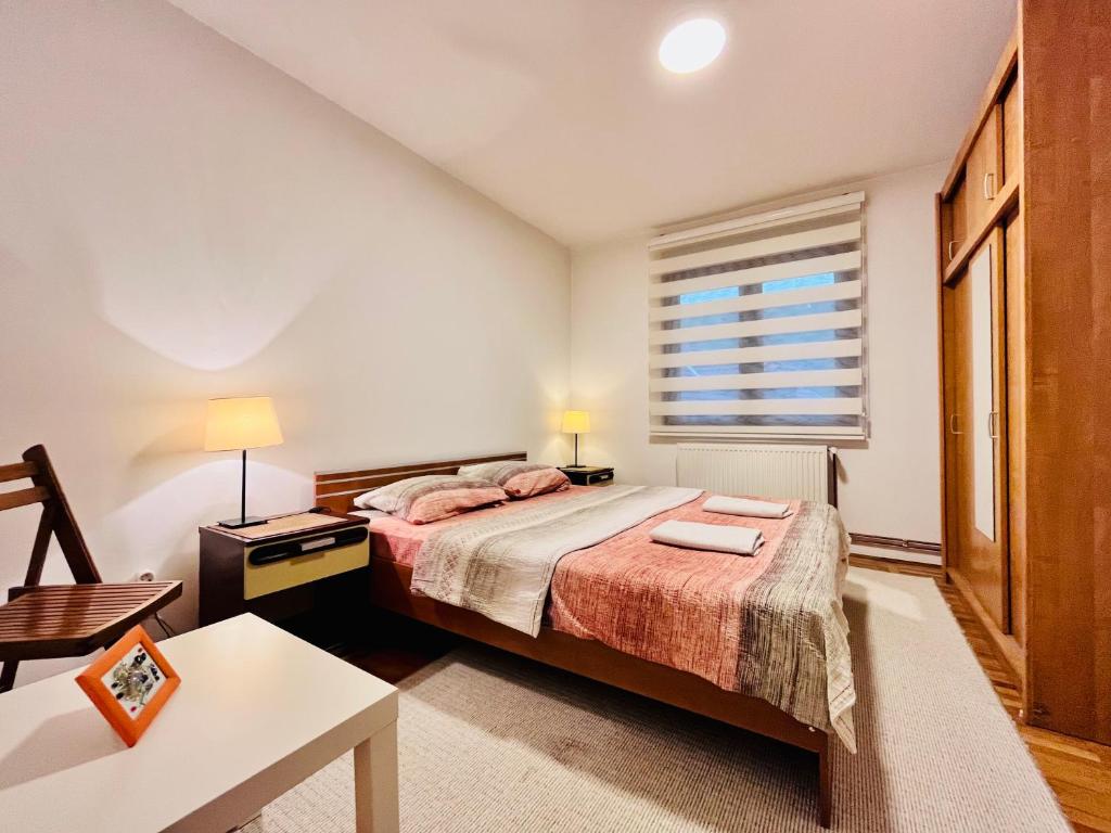 Ένα ή περισσότερα κρεβάτια σε δωμάτιο στο Apartment Viktorija