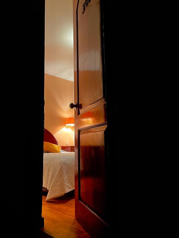 Postel nebo postele na pokoji v ubytování Hotel Vilandre