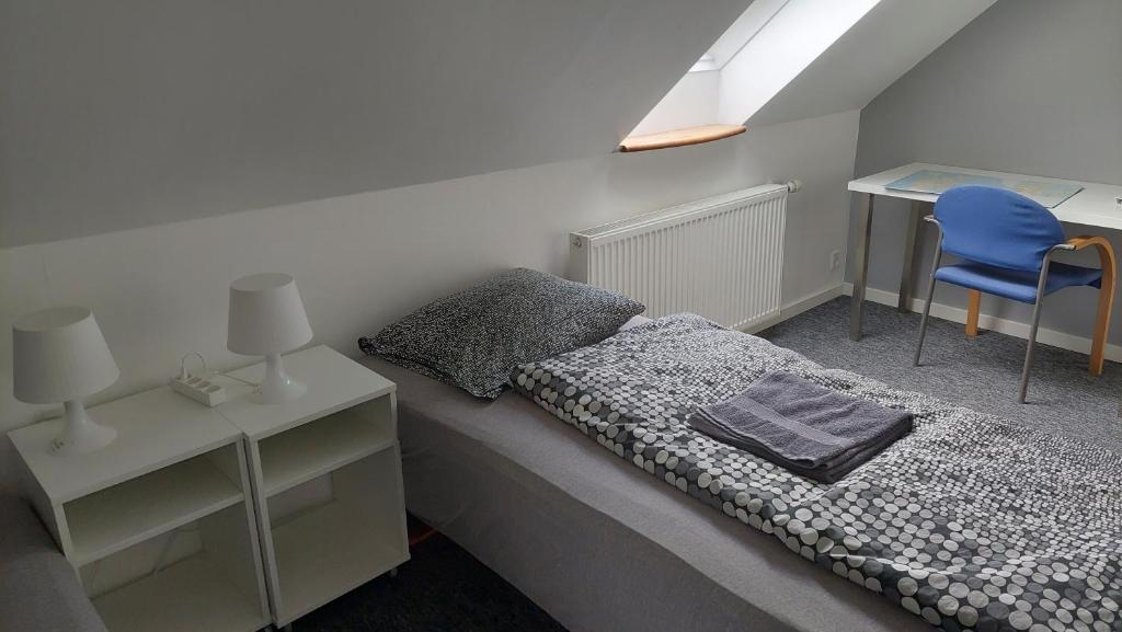 Postel nebo postele na pokoji v ubytování Ringslund B&B