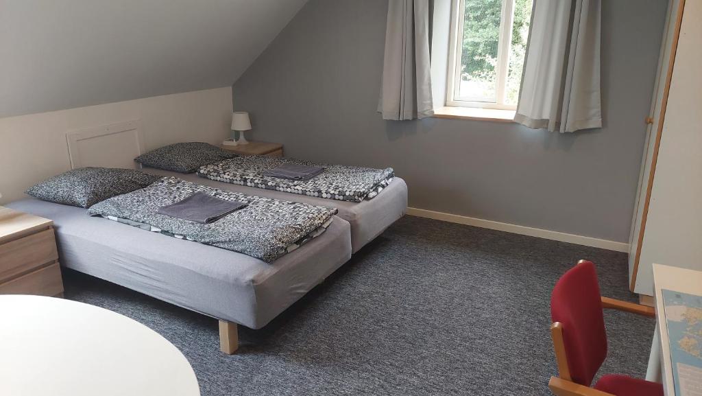 Postel nebo postele na pokoji v ubytování Ringslund B&B