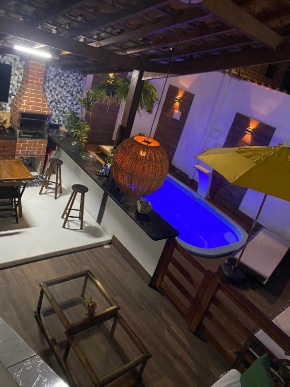 an overhead view of a pool with a table and chairs at Casa Paraty Mara in Paraty