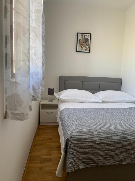 Postel nebo postele na pokoji v ubytování Apartmani Silence