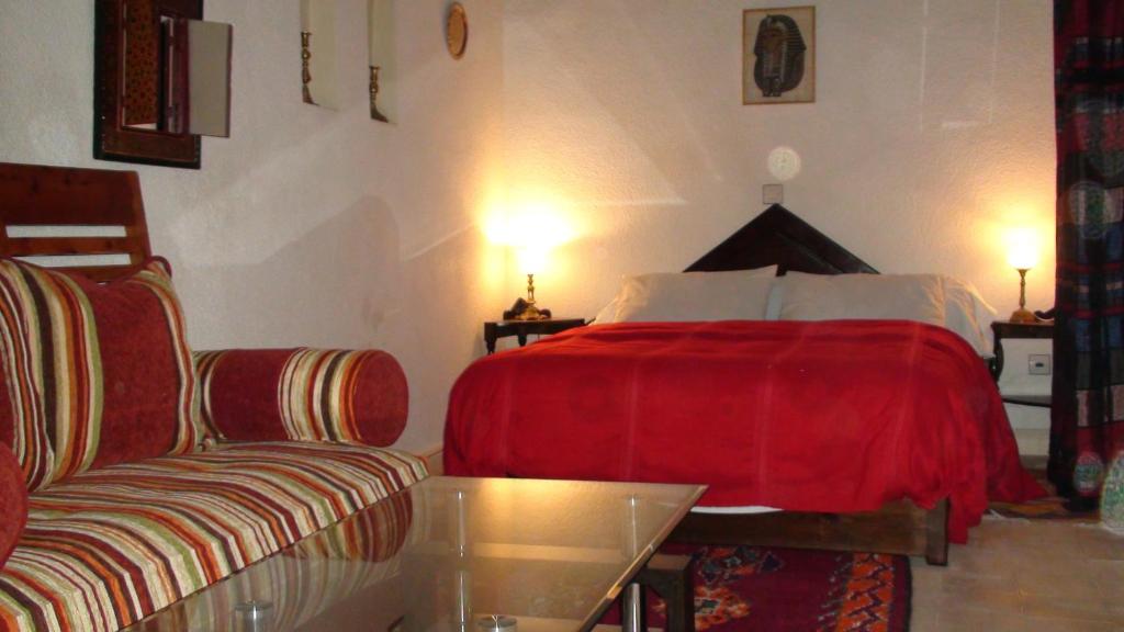Postel nebo postele na pokoji v ubytování Riad Arambys