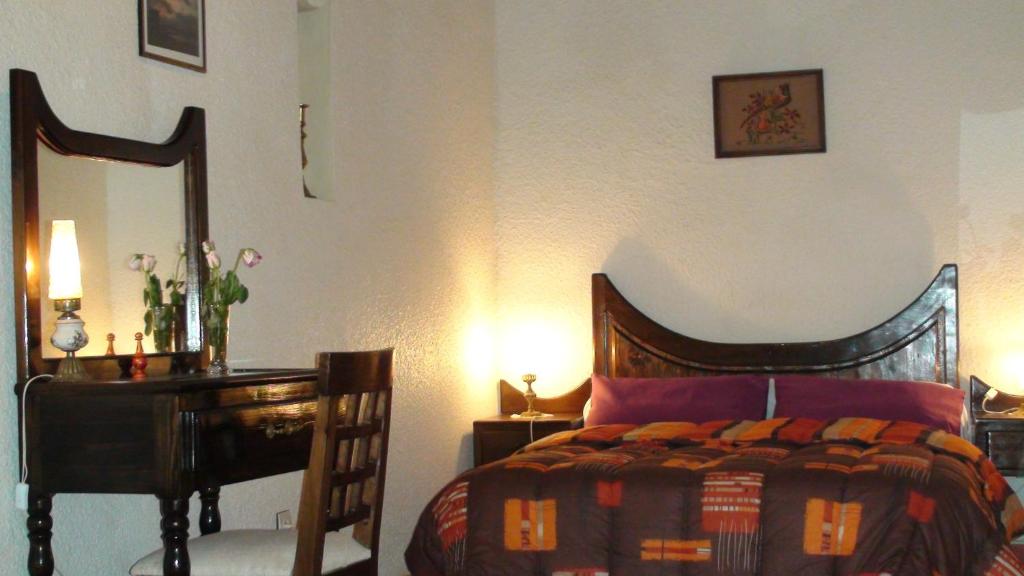 Postel nebo postele na pokoji v ubytování Riad Arambys