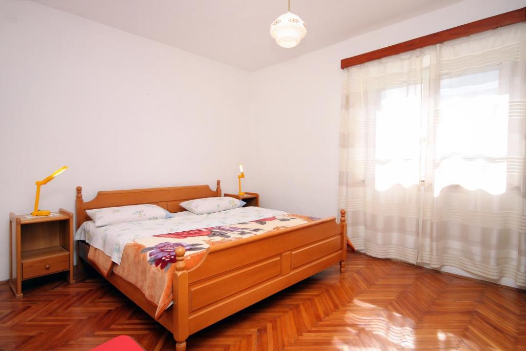Postel nebo postele na pokoji v ubytování Apartments by the sea Lumbarda, Korcula - 9330