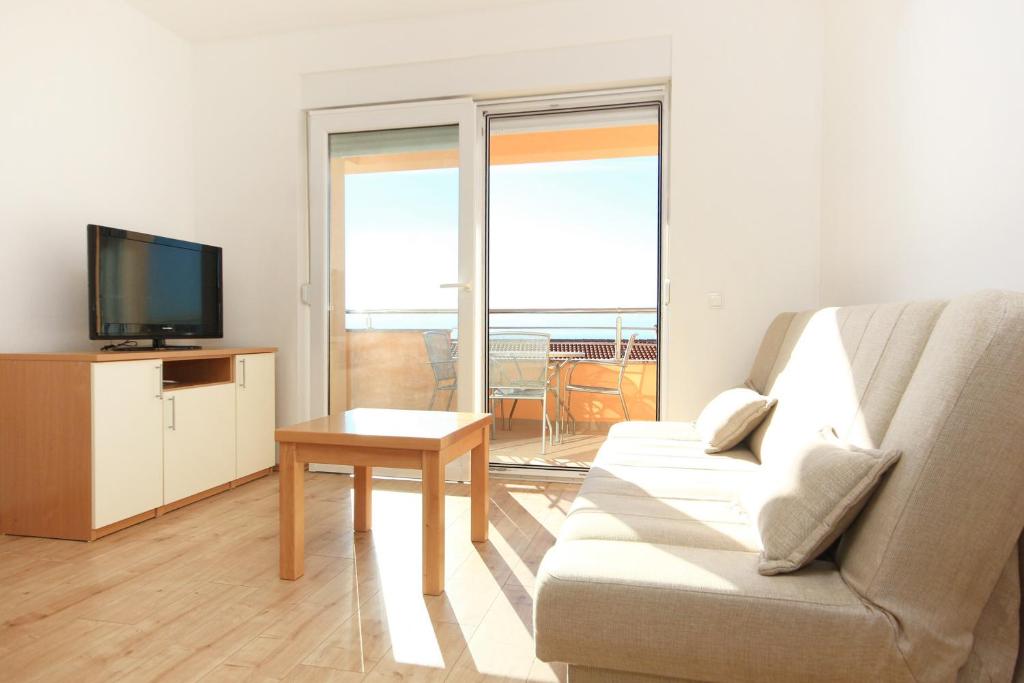 Televízia a/alebo spoločenská miestnosť v ubytovaní Apartment Duce 9437e