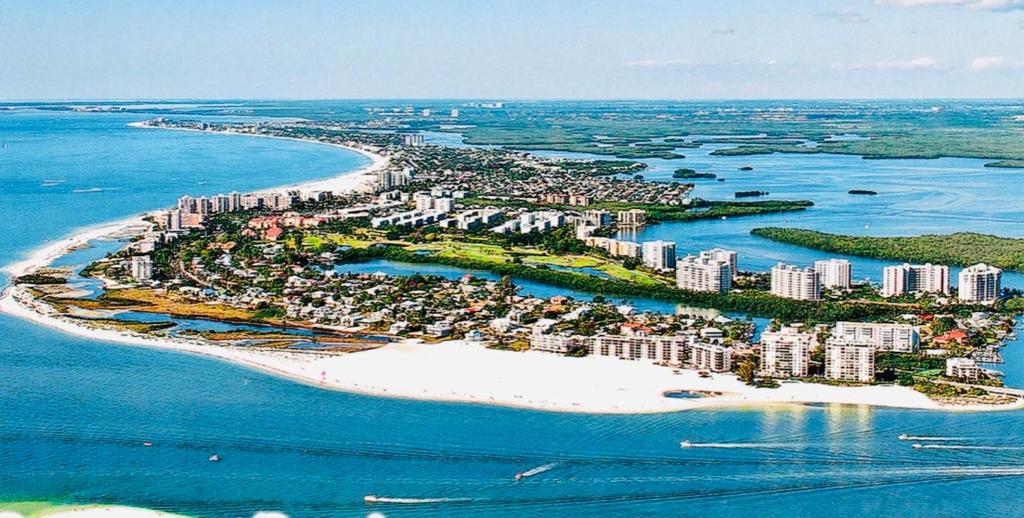 an aerial view of an island in the ocean at Luxury beach condo located on the bay in a Tropical Oasis!!! in Fort Myers Beach
