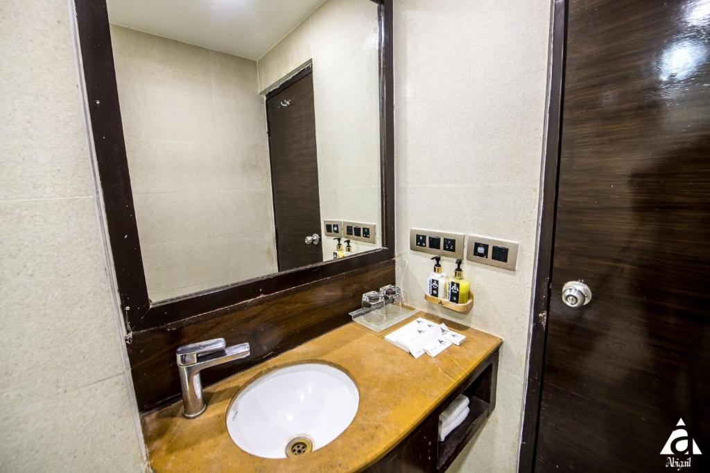 Koupelna v ubytování Hotel Abigail Goradia's