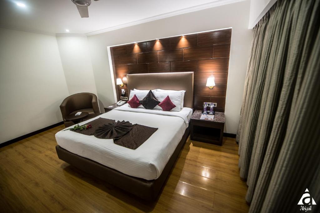Postel nebo postele na pokoji v ubytování Hotel Abigail Goradia's