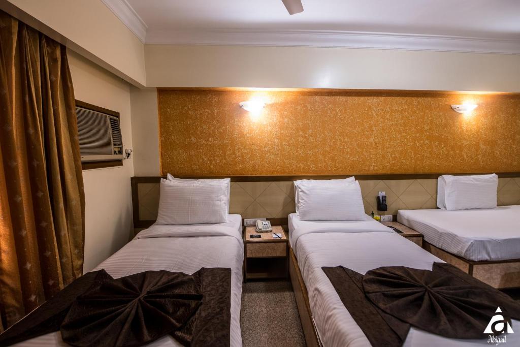 Postel nebo postele na pokoji v ubytování Hotel Abigail Goradia's