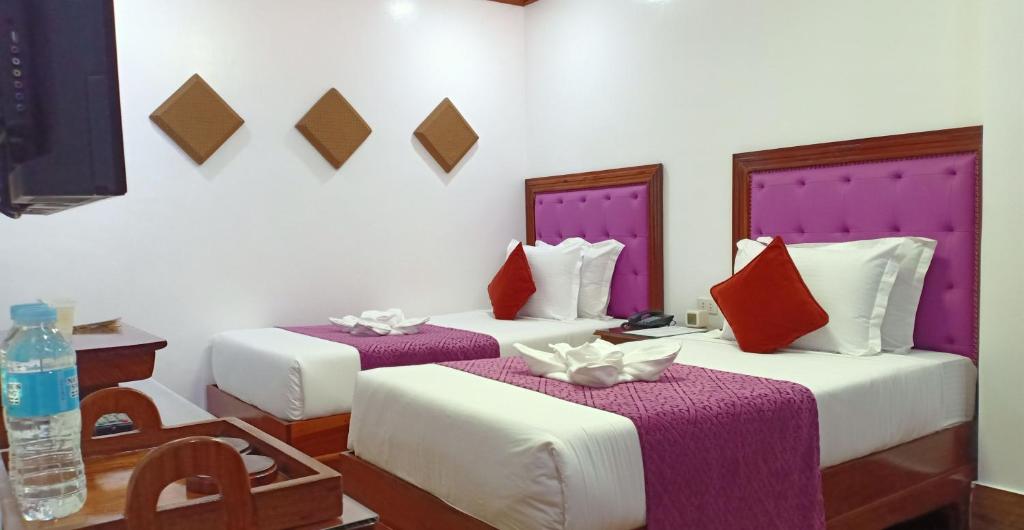 Postel nebo postele na pokoji v ubytování CLN Boutique Hotel