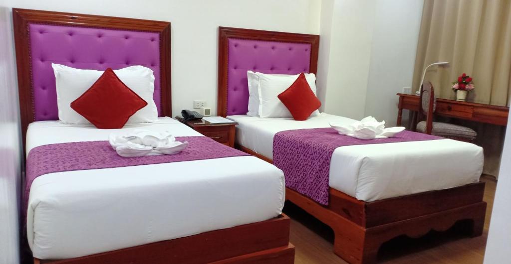 Postel nebo postele na pokoji v ubytování CLN Boutique Hotel