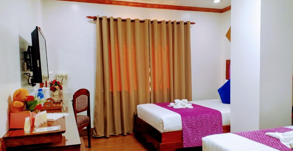 Postel nebo postele na pokoji v ubytování CLN Boutique Hotel