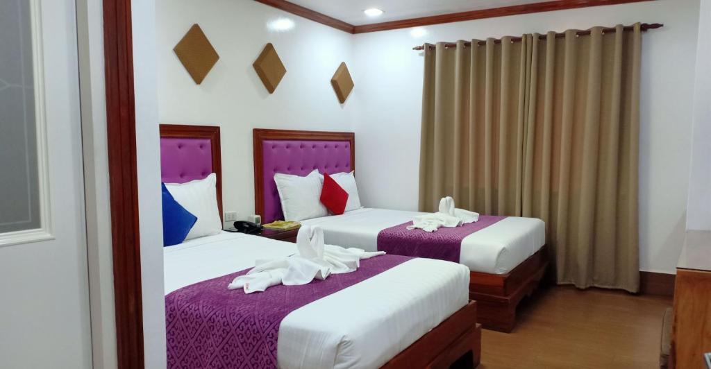 Postel nebo postele na pokoji v ubytování CLN Boutique Hotel