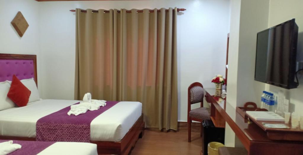 Postel nebo postele na pokoji v ubytování CLN Boutique Hotel