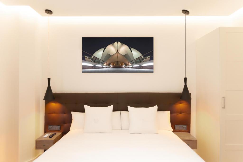 Postel nebo postele na pokoji v ubytování Woohoo Rooms Boutique Gran Vía