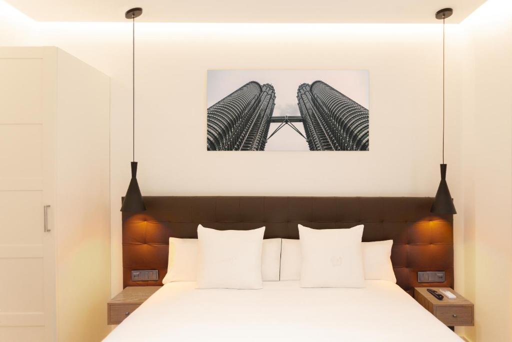 Postel nebo postele na pokoji v ubytování Woohoo Rooms Boutique Gran Vía