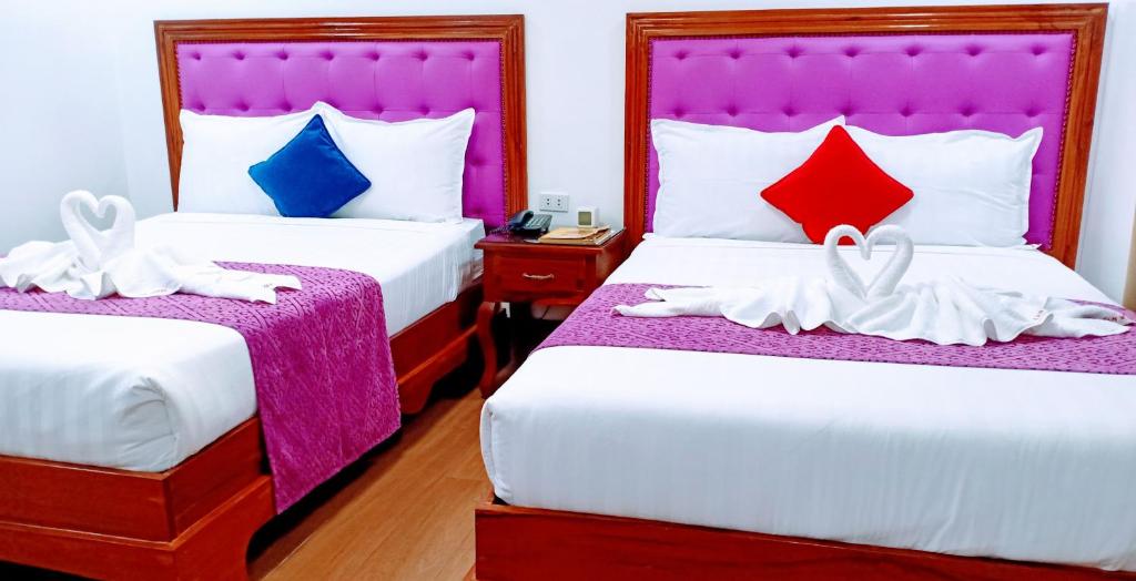 Postel nebo postele na pokoji v ubytování CLN Boutique Hotel