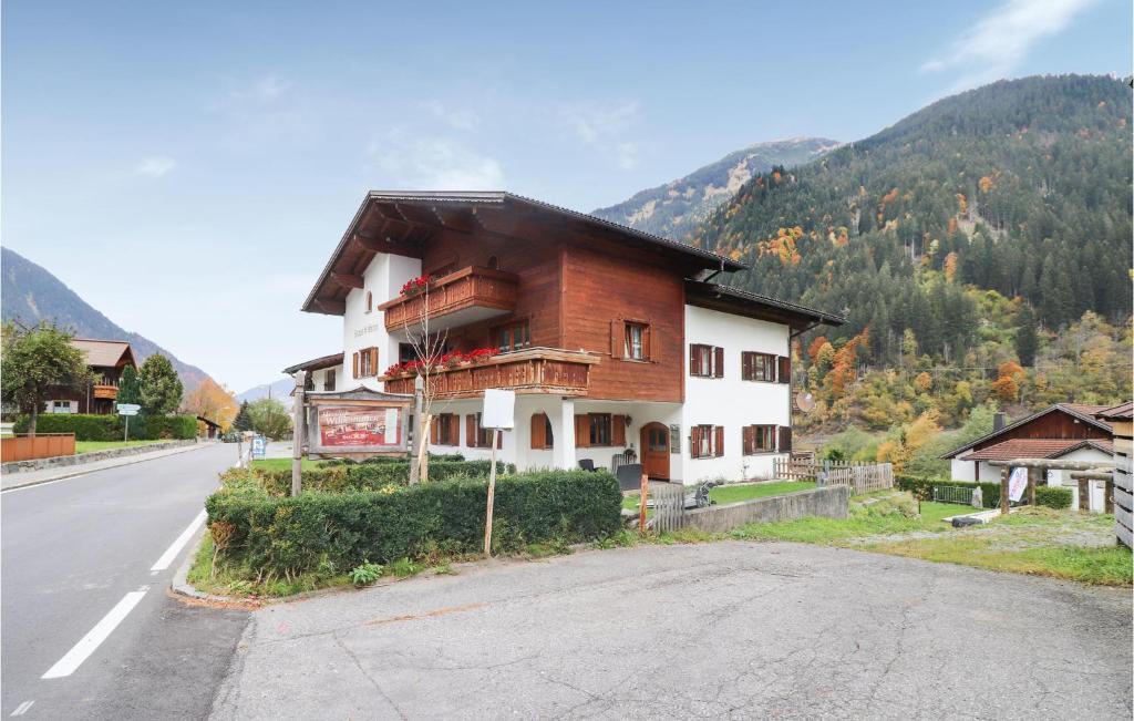 a house sitting on the side of a road at Lovely Apartment In St, Gallenkirch With Kitchen in Aussersiggam