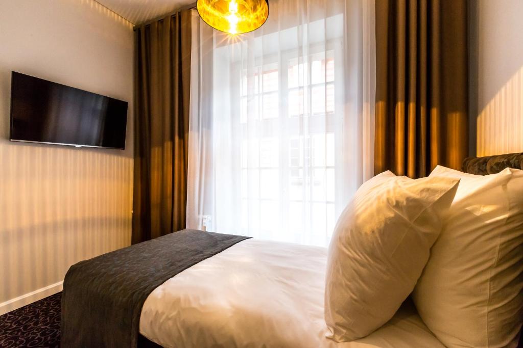 Posteľ alebo postele v izbe v ubytovaní Sleep in Hostel & Apartments Stary Rynek