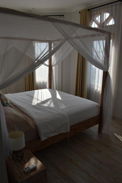 Postel nebo postele na pokoji v ubytování Villa Reva Bali