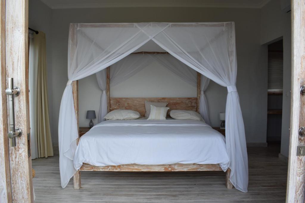 Postel nebo postele na pokoji v ubytování Villa Reva Bali