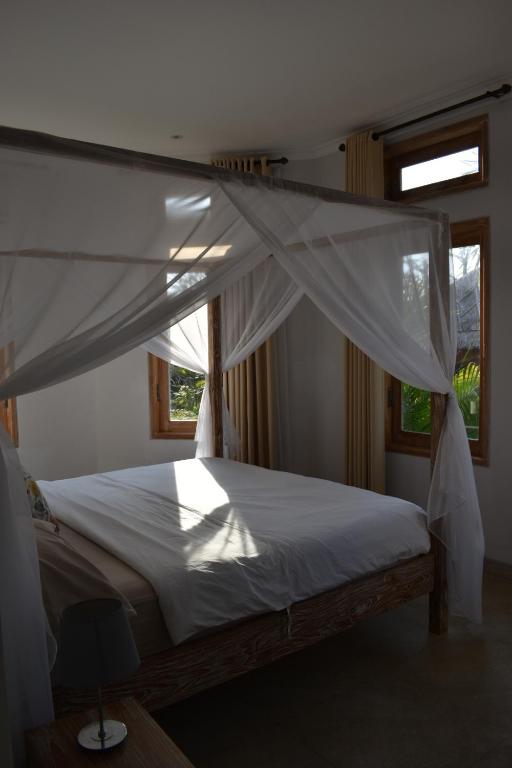 Postel nebo postele na pokoji v ubytování Villa Reva Bali