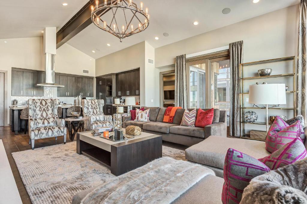 a living room with a couch and a table at Four Bedroom Penthouse apartment hotel in Park City