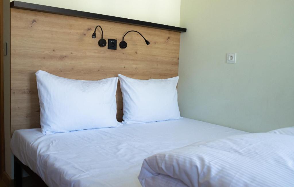 Postel nebo postele na pokoji v ubytování FOKA Hostel