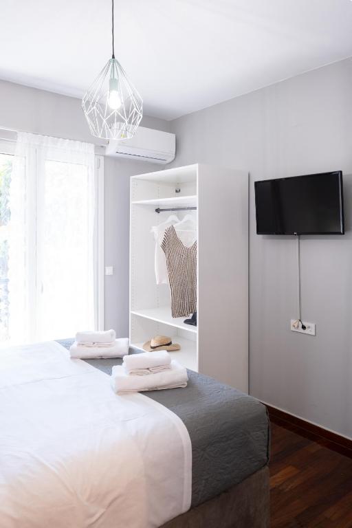 Postel nebo postele na pokoji v ubytování Chania Central Apartment