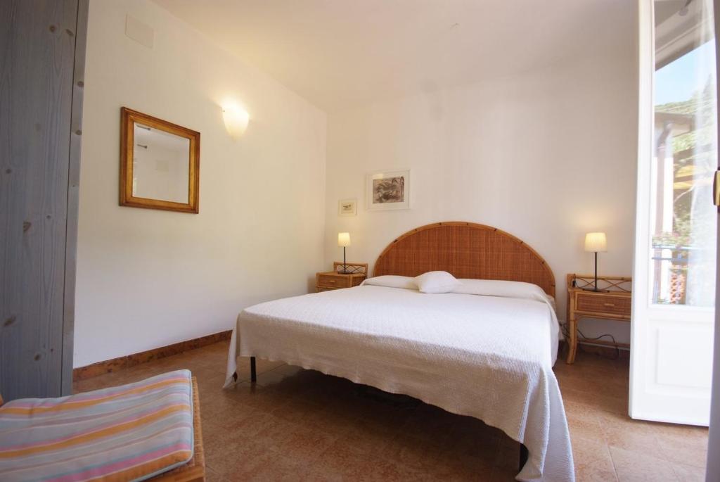 Postel nebo postele na pokoji v ubytování Residence Villa Morcone