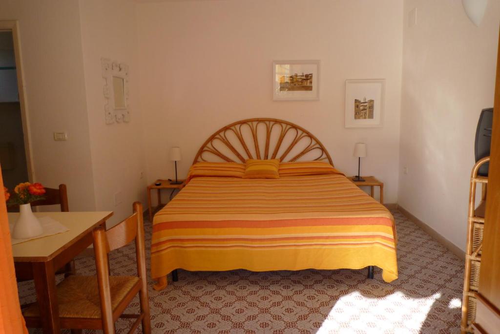 Postel nebo postele na pokoji v ubytování Residence Villa Morcone