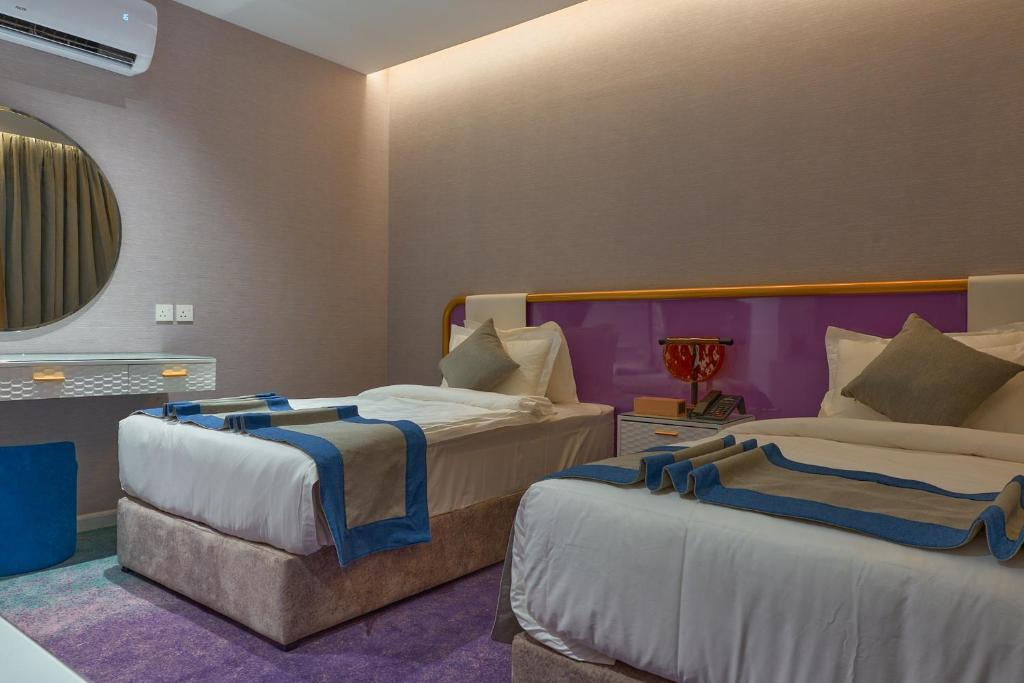 Postel nebo postele na pokoji v ubytování Marvelous Hotel