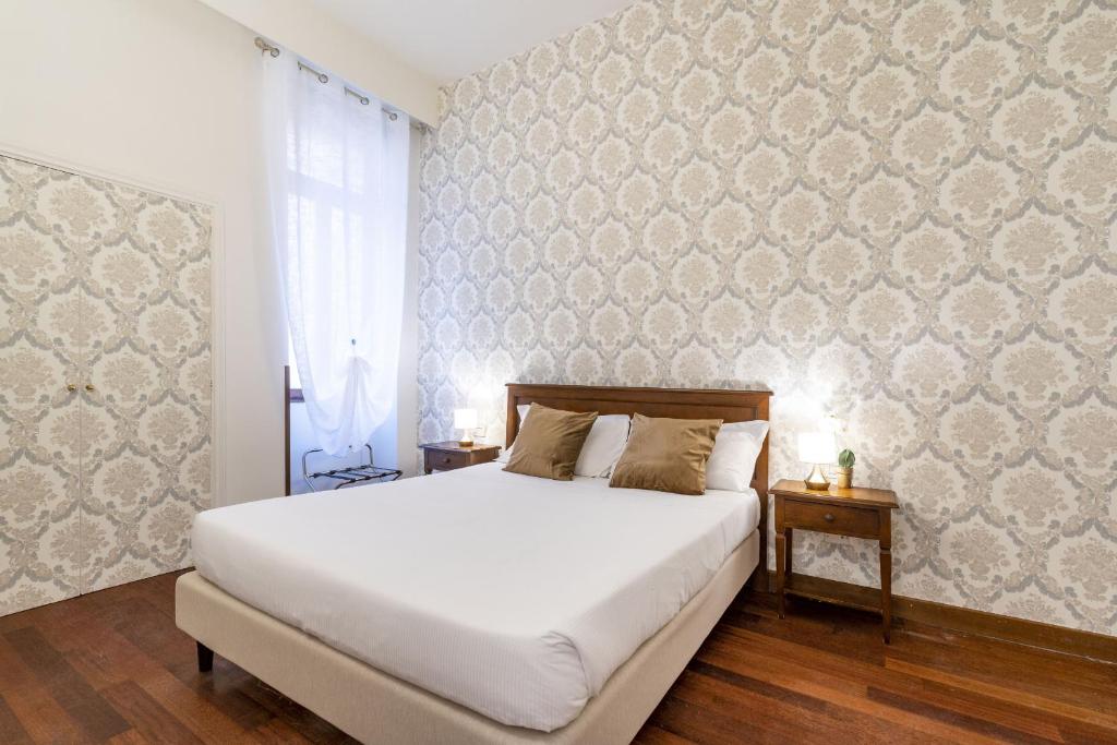 Łóżko lub łóżka w pokoju w obiekcie Residenza Centopietre - Dorsoduro by Wonderful Italy