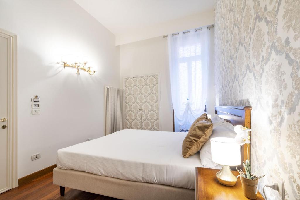 Łóżko lub łóżka w pokoju w obiekcie Residenza Centopietre - Dorsoduro by Wonderful Italy