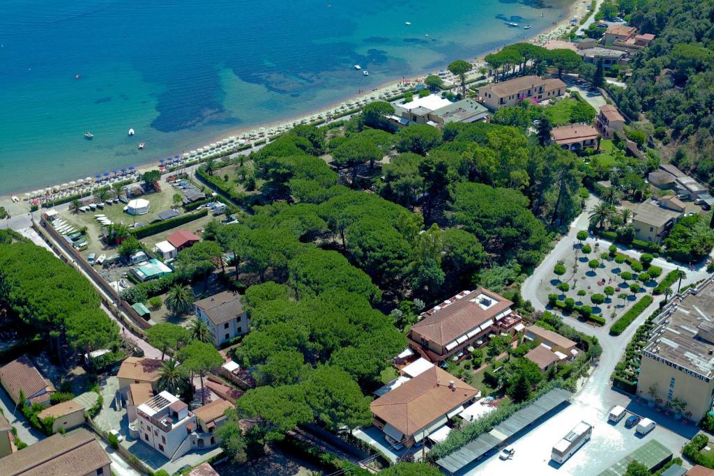 an aerial view of a city with trees and a beach at Hotel Anfora in Capoliveri