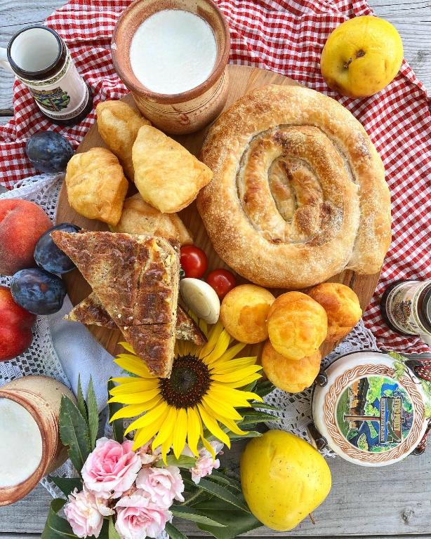 a plate of bread and other foods on a table at ETNO SELO VRANEŠA Zlatar in Nova Varoš