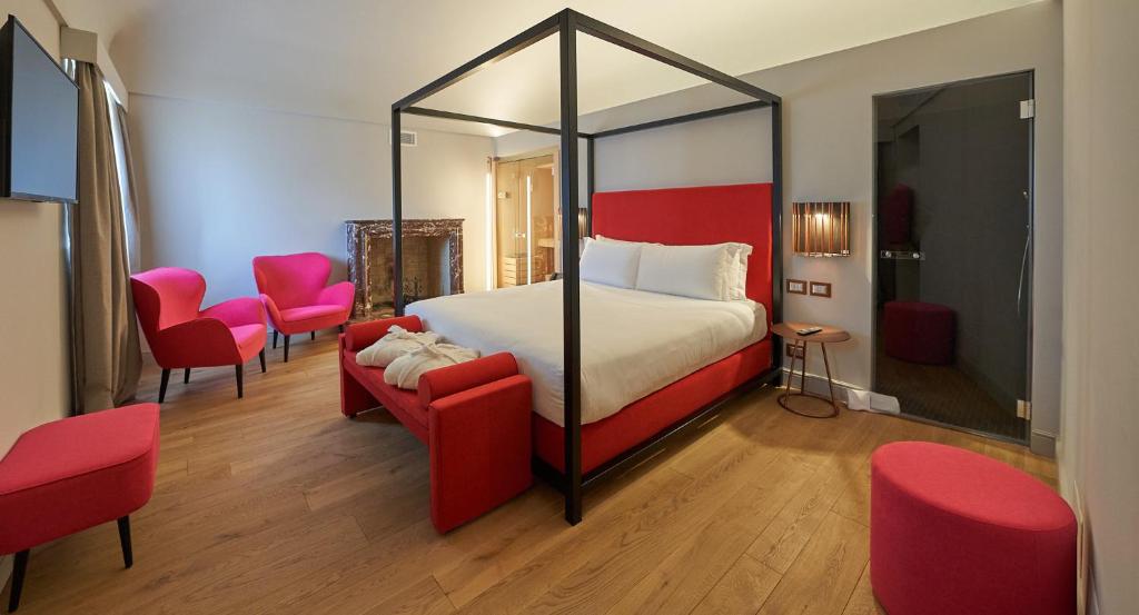 Postel nebo postele na pokoji v ubytování RELAIS CASCINA ERA
