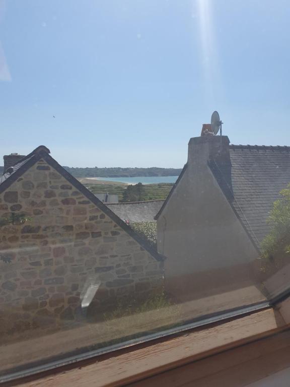 a view from a window of a brick building at Maison typique bretonne a 5 min de la plage a pied in Crozon